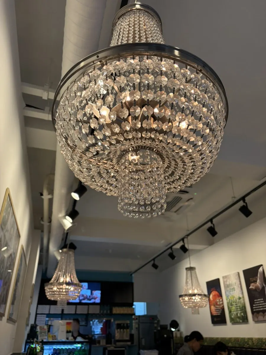 Interior with chandeliers hanging over every table