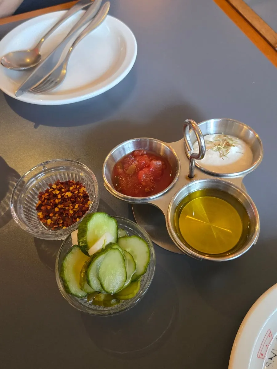 Three house sauces with pickles and pepperoncino
