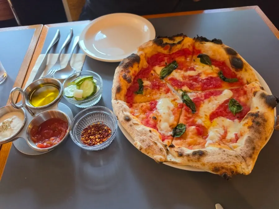 Freshly baked margherita wood-fired pizza