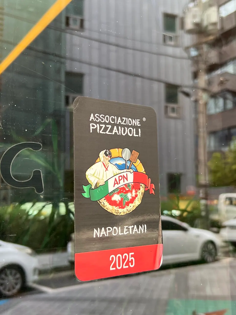 Menu board placed outside Pizzeria Snug