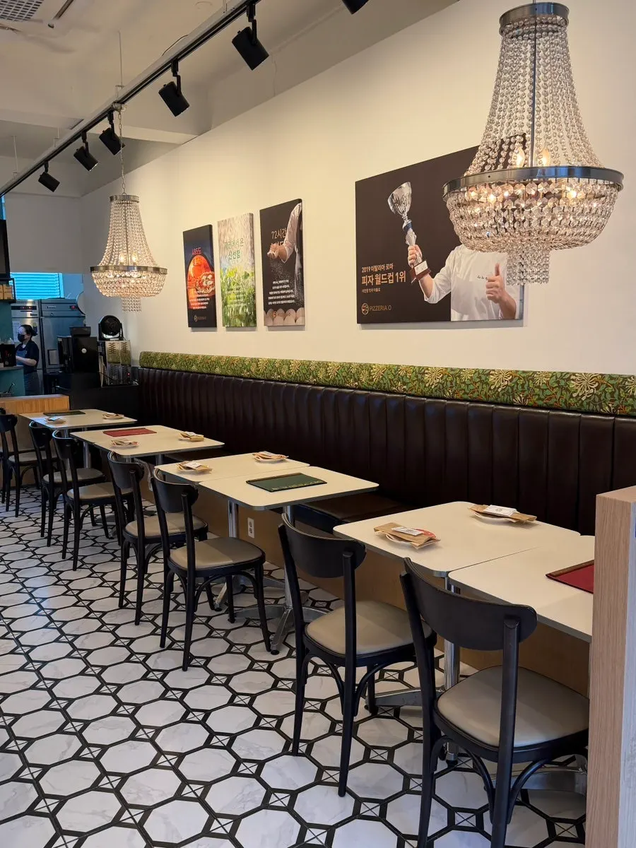 Interior of Pizzeria O Hapjeong Station with generously spaced tables