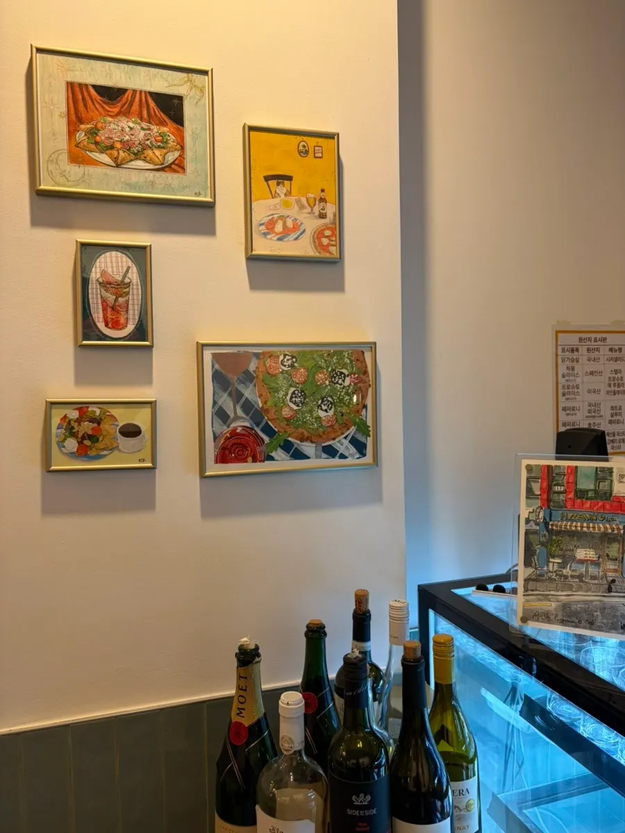 Interior of Pizzeria O Hapjeong Station lit with warm lighting