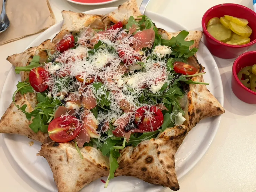 Full view of the star-shaped Stella pizza