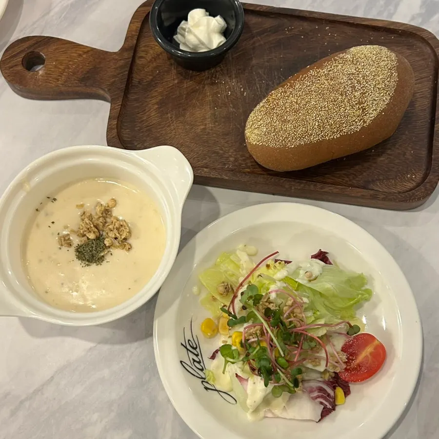 Salad, bread, and soup served as part of the set menu