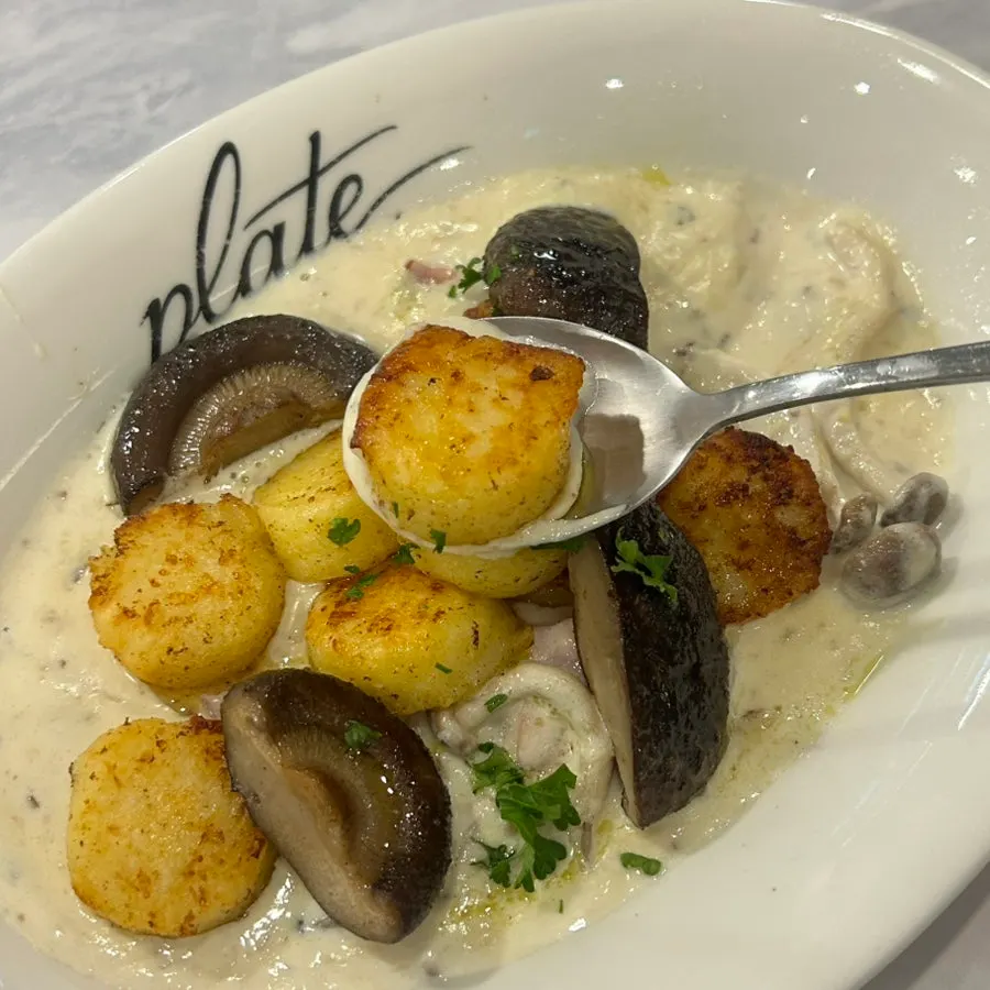 A plate of truffle bacon cream gnocchi