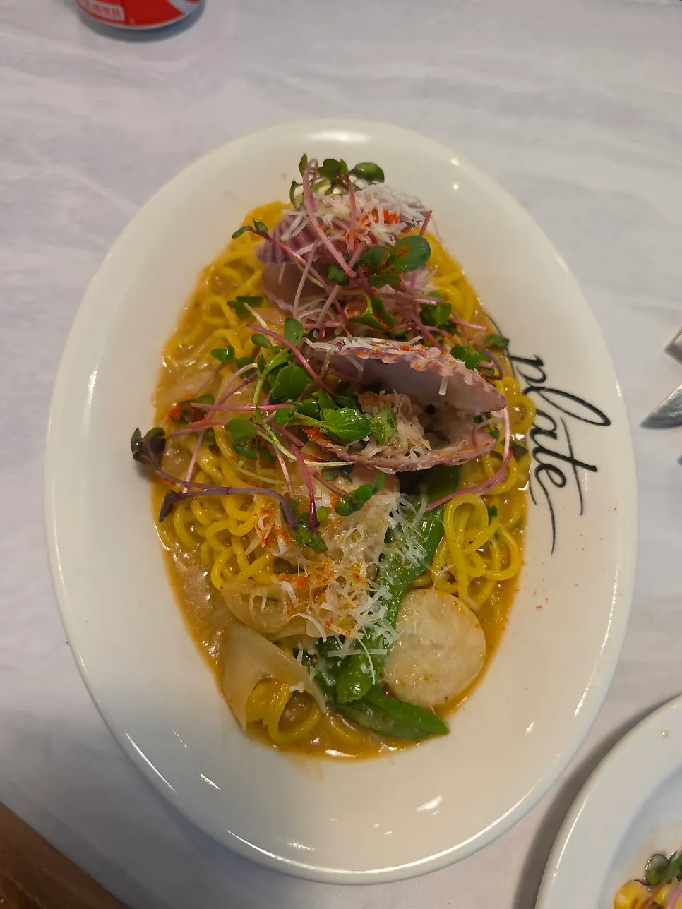 Close-up of scallop uni oil pasta