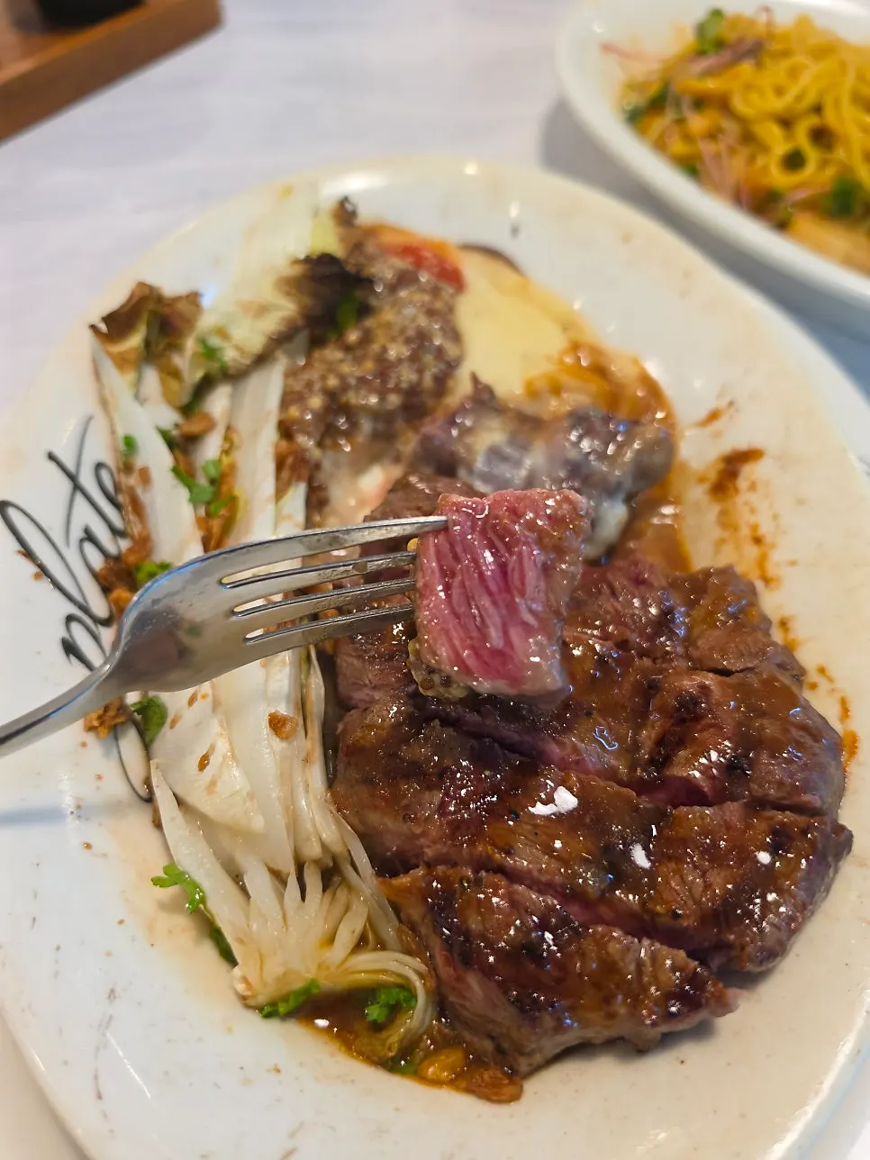 Cross-section of steak with sauce drizzled on top