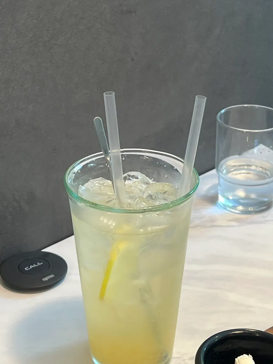 A glass of lemonade served at the table