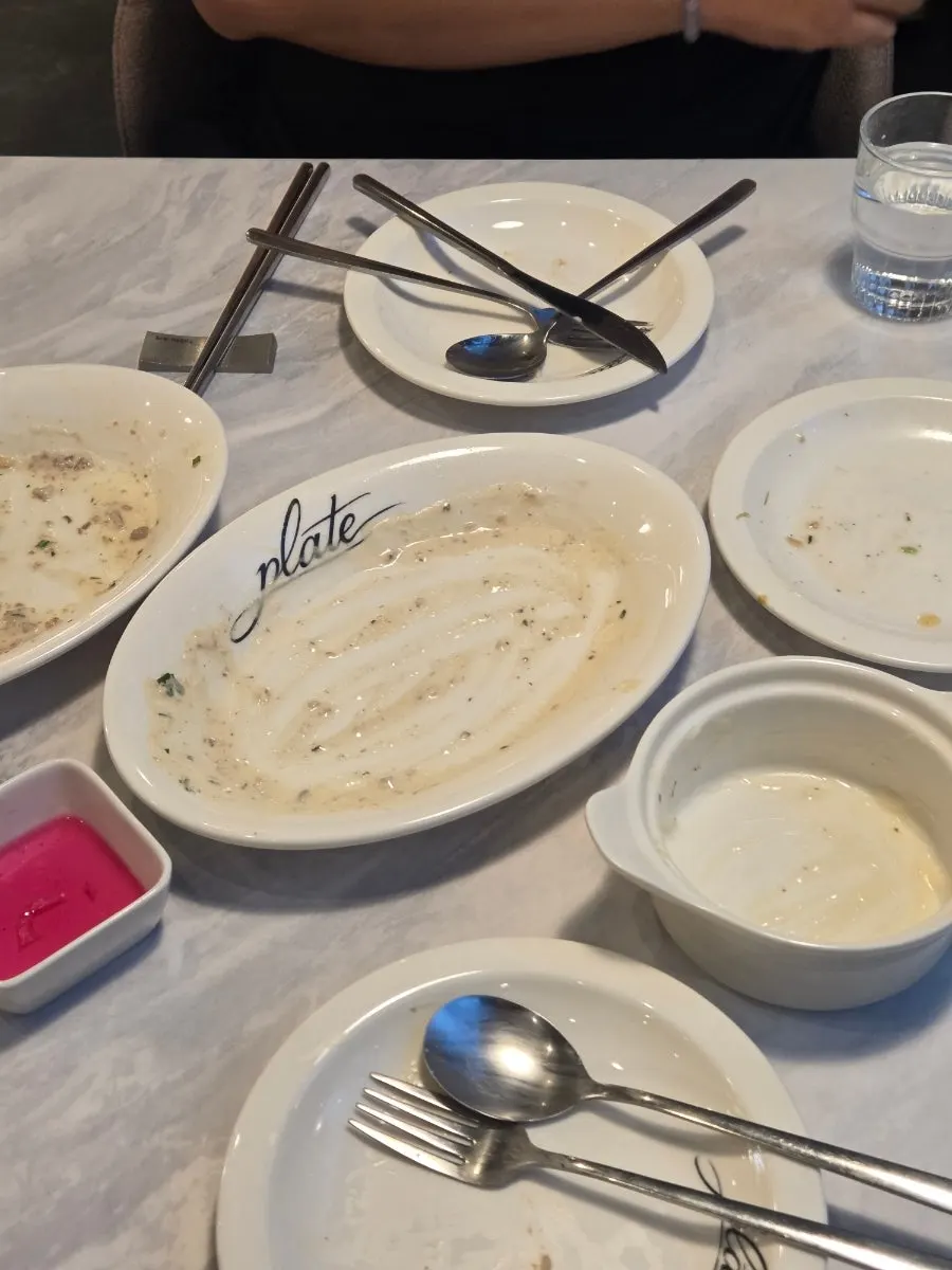 Pasta plate emptied down to the sauce