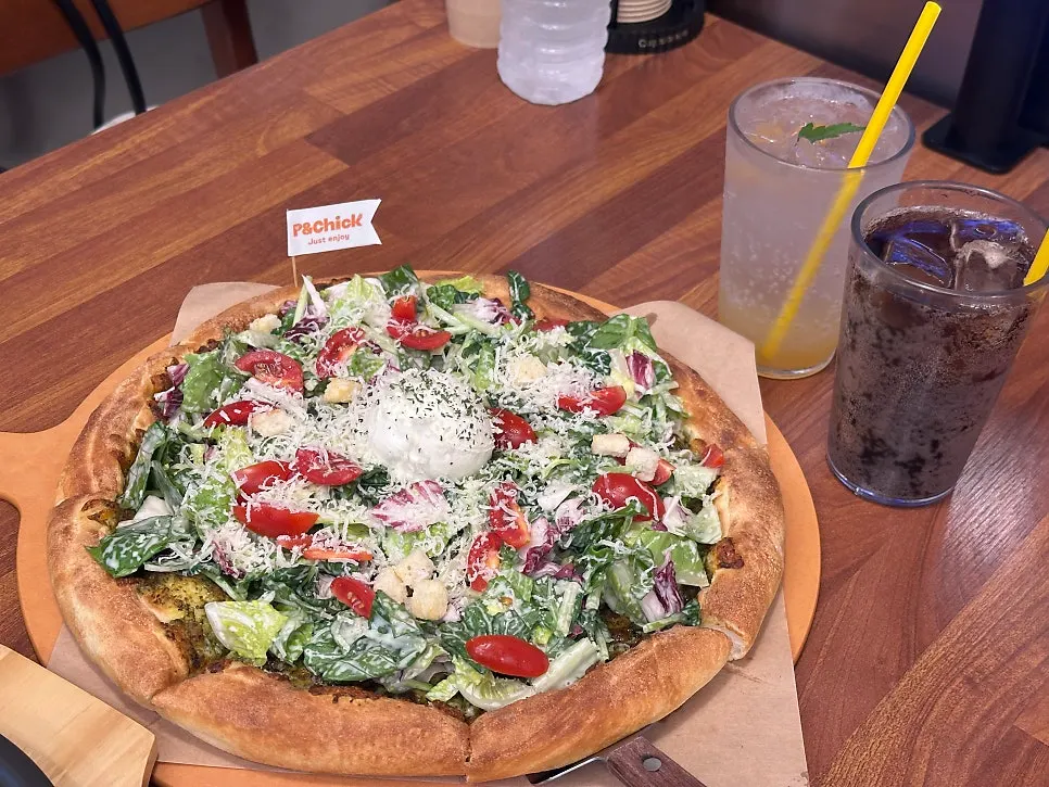 Salad pizza piled high with toppings