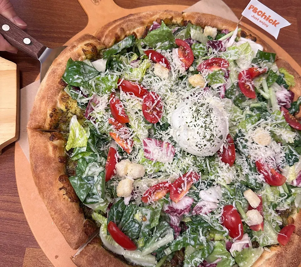 Close-up of toppings on the Basil Caesar Salad Pizza