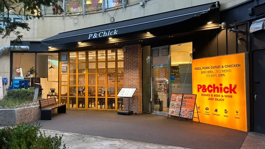 A spread of pizza and chicken at P&Chick in Sinjung-dong, Bucheon