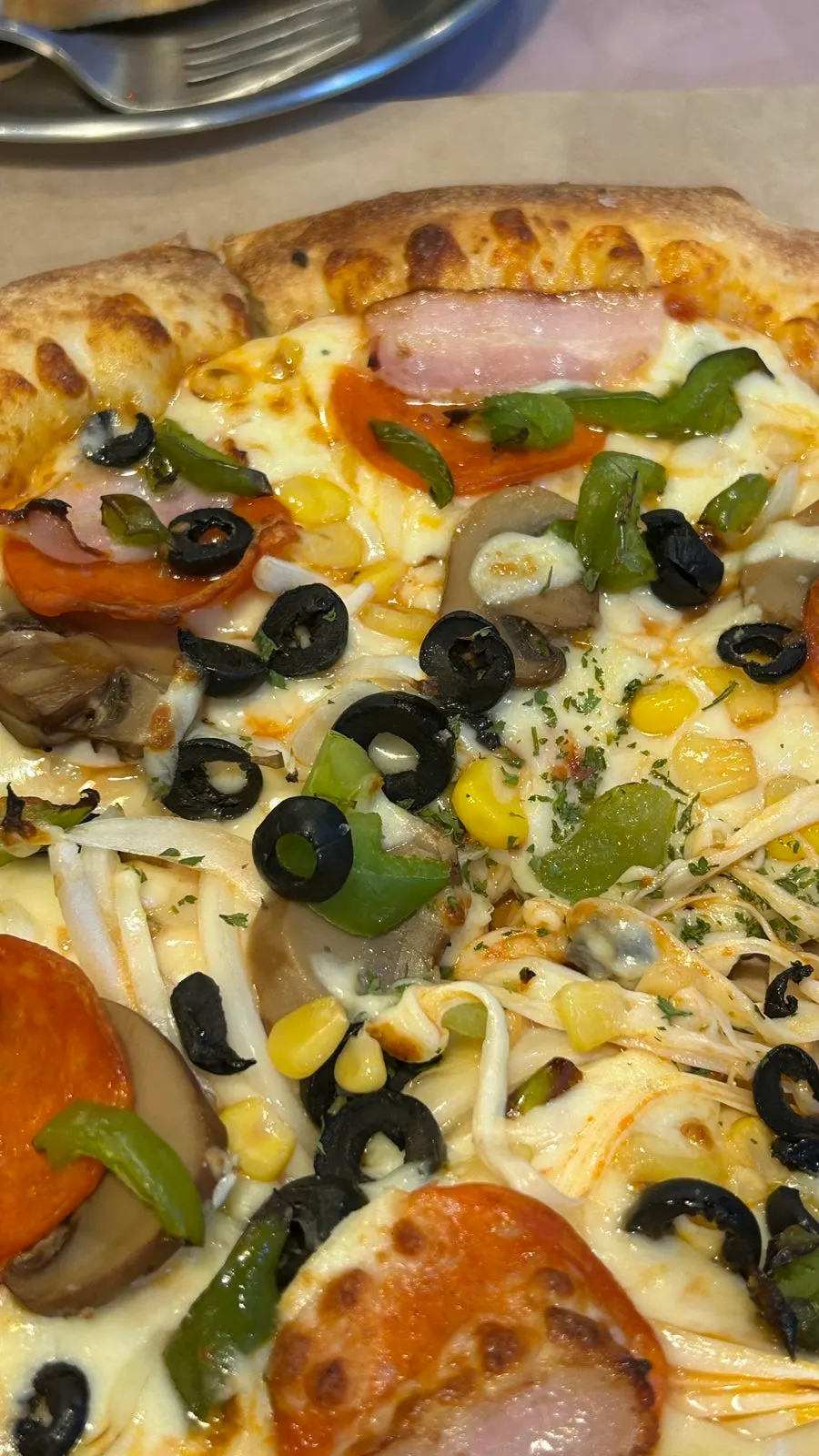 A slice of pizza dipped in the sauce