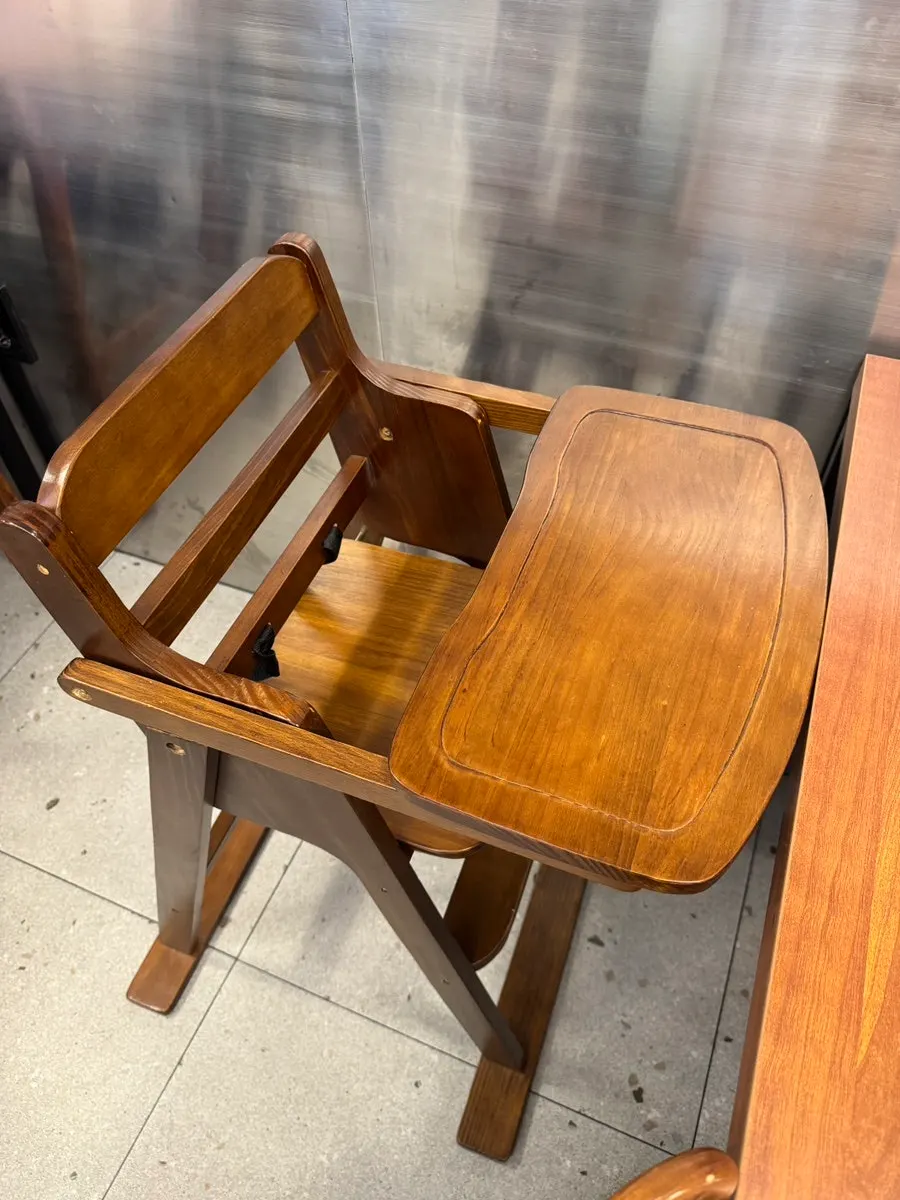 Baby seated in a baby chair while eating