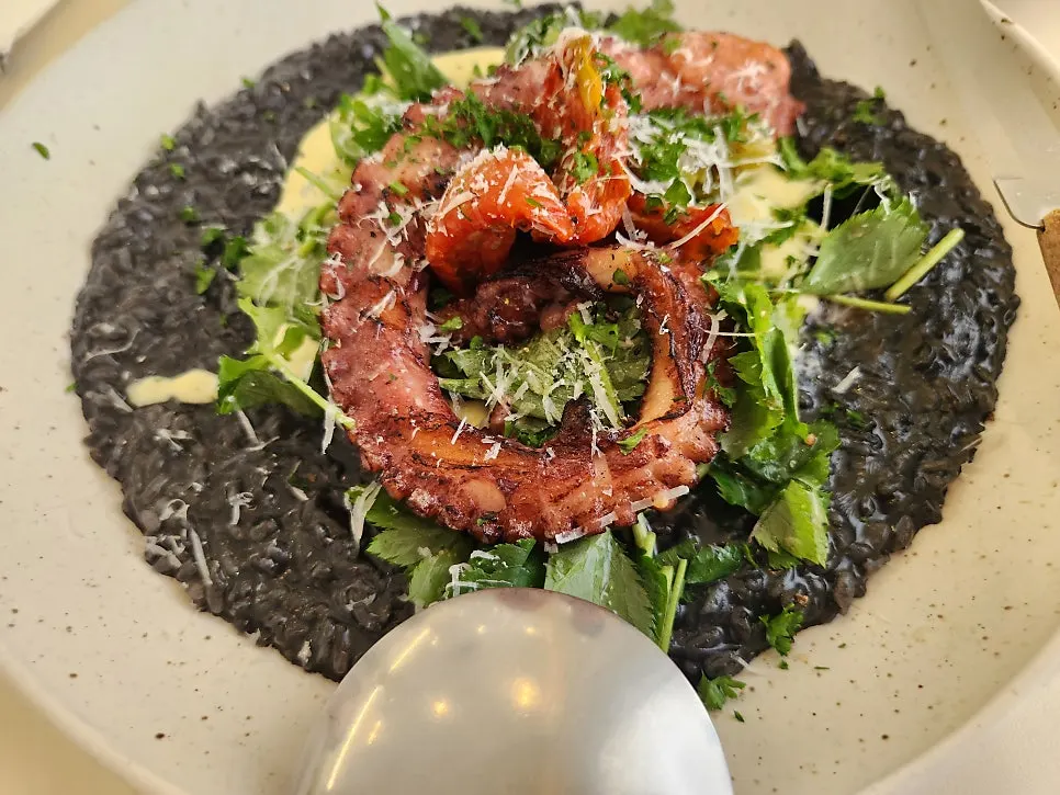 Close-up of Eoneu Dal's salad sauce and vegetables