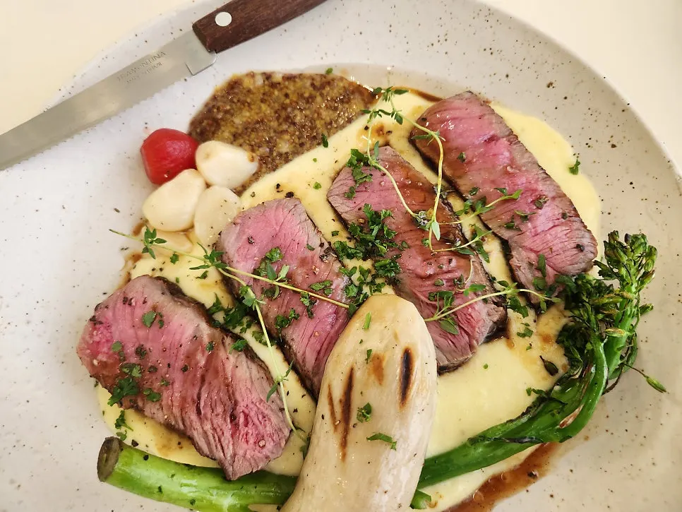 Beef steak piled high with cheese