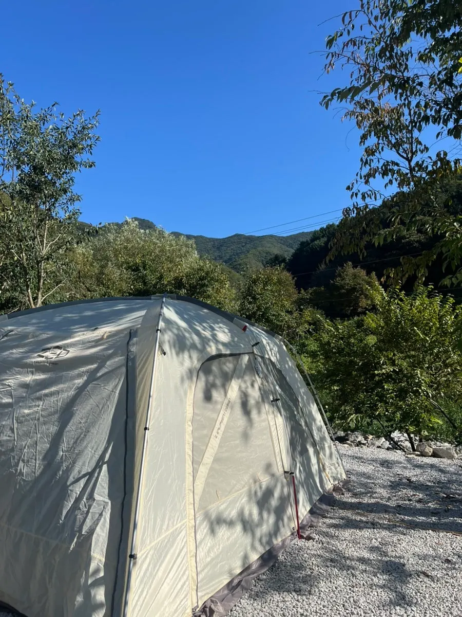 Tent fully pitched with mountains in the background