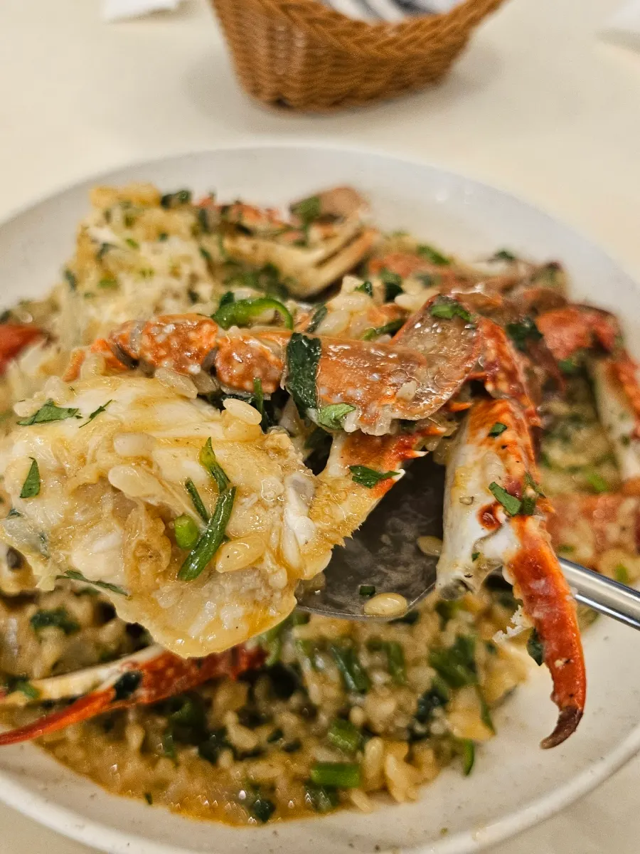 A spoonful of Eoneu Dal crab risotto with crab meat
