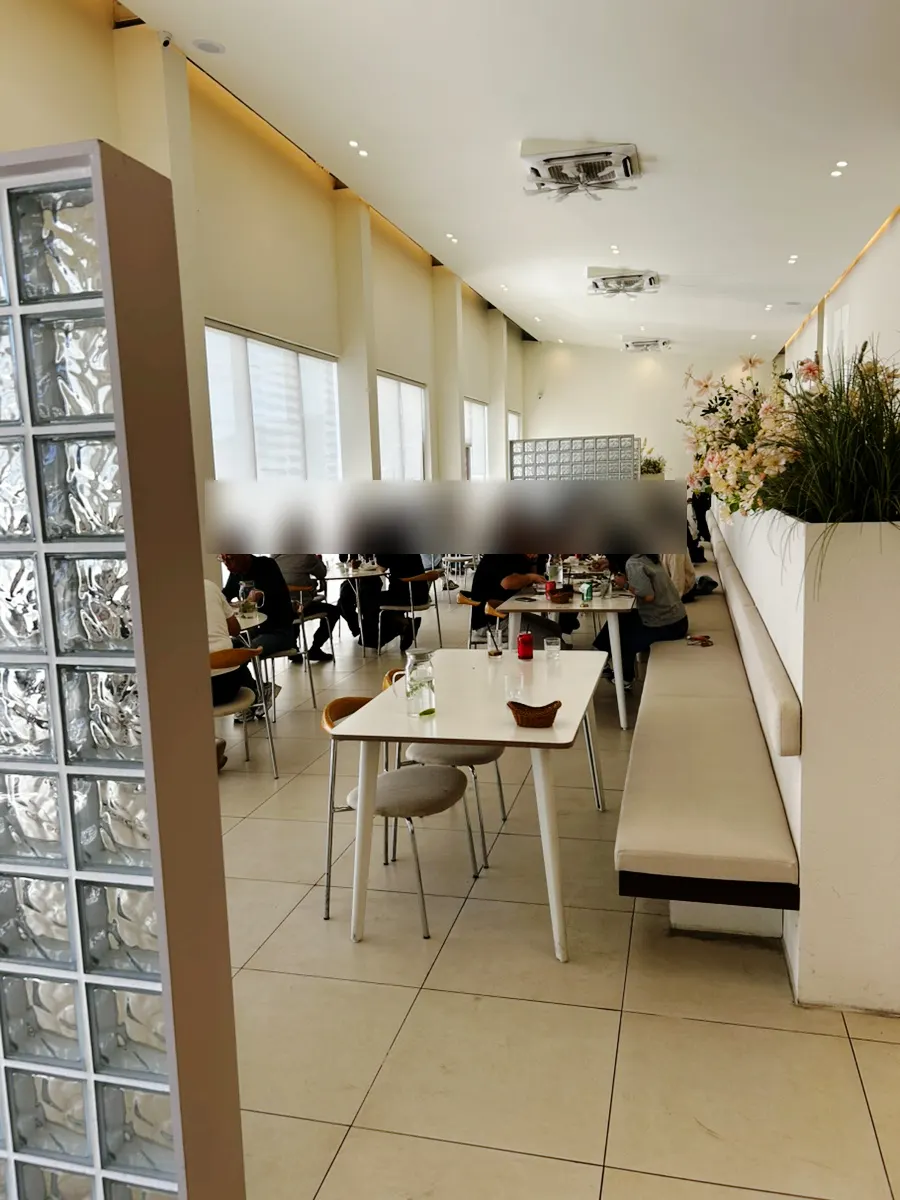 High-ceilinged, white interior with large windows at Eoneu Dal