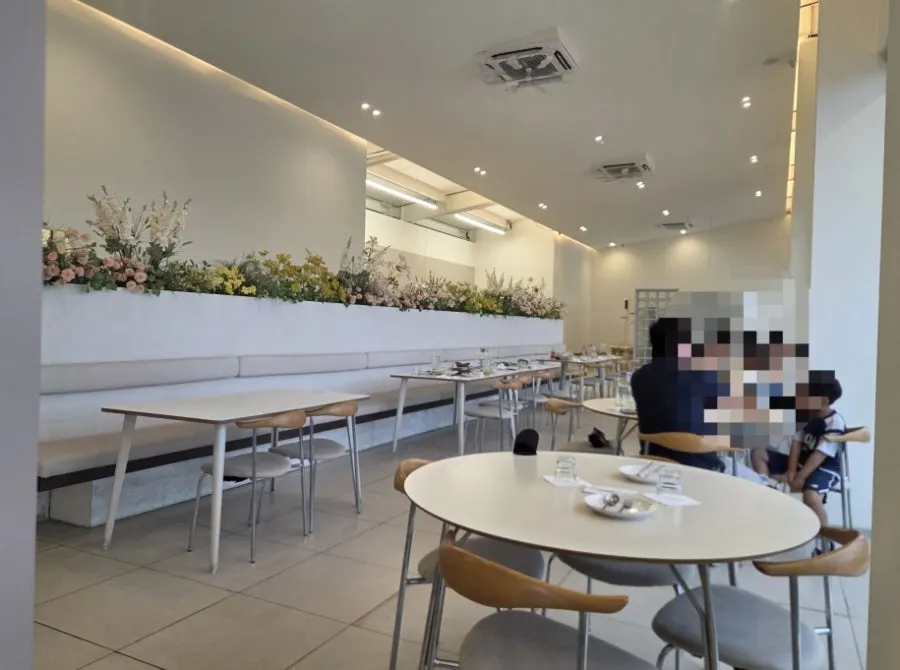 White-toned dining hall seating at Eoneu Dal