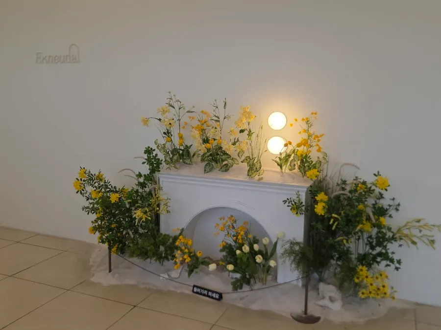 Group seating at Eoneu Dal decorated with yellow flowers