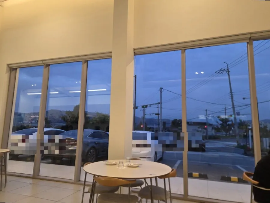 Evening sky seen through Eoneu Dal's floor-to-ceiling windows