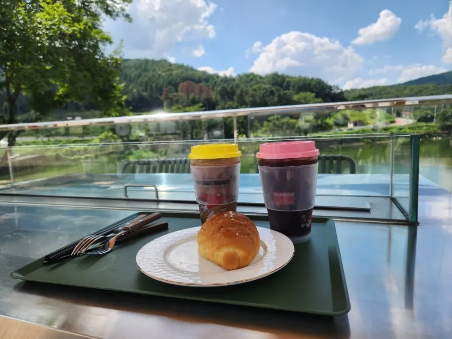 Two coffees pictured with the scenery