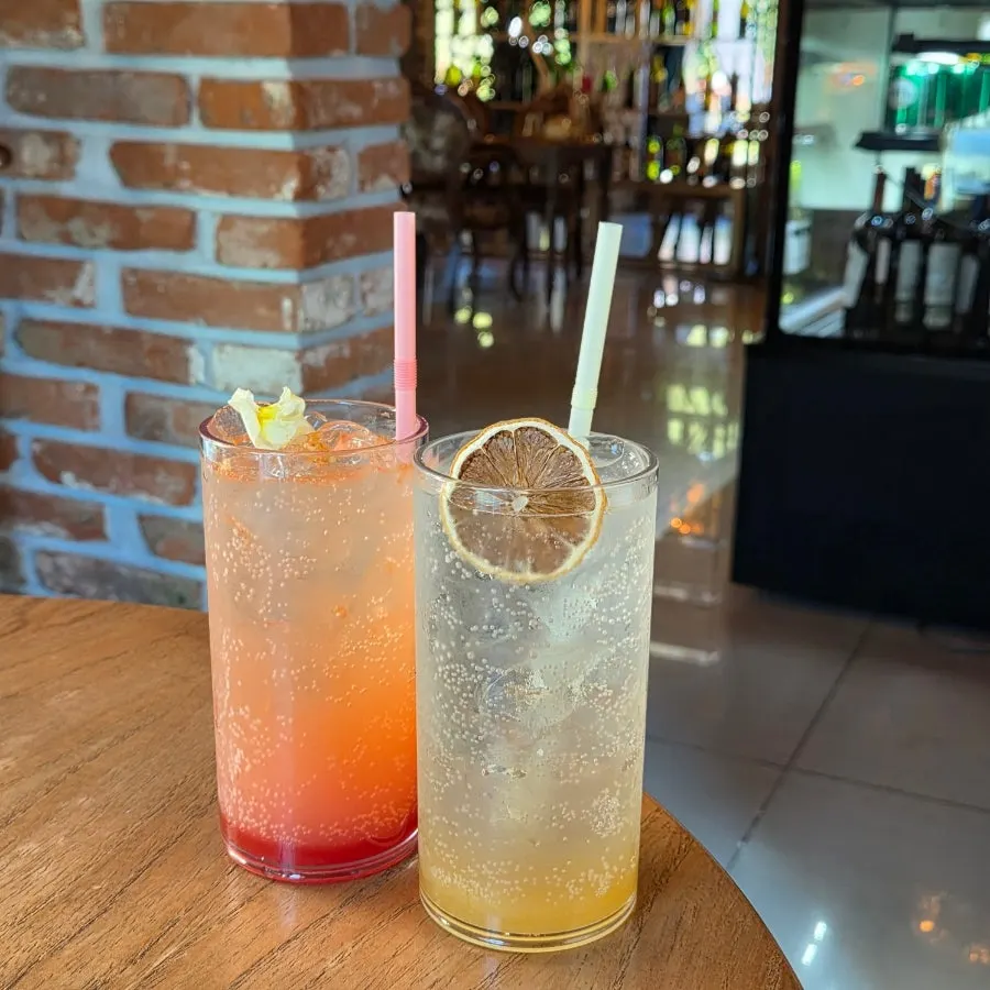 Two glasses of lemon-honey ade and grapefruit ade