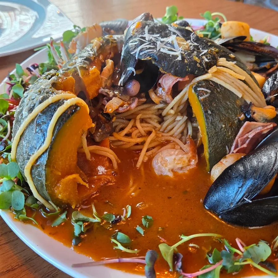 Close-up of seafood topping on zucca dolce