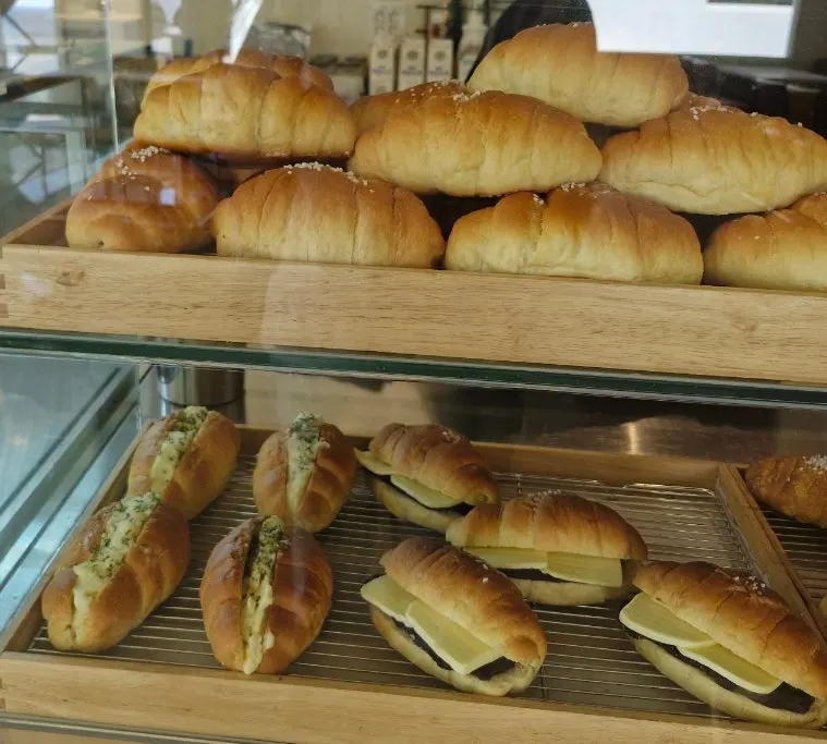 Salt bread and scones displayed in the case