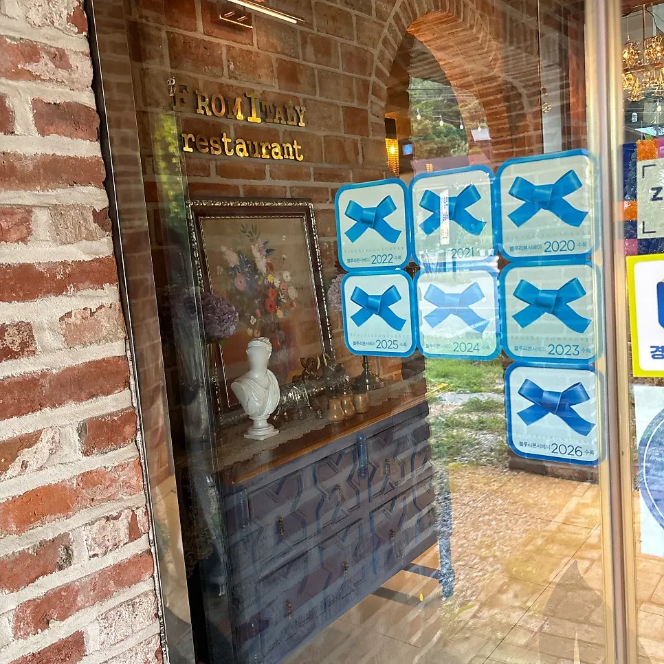 Blue Ribbon award hanging at the entrance of From Italy