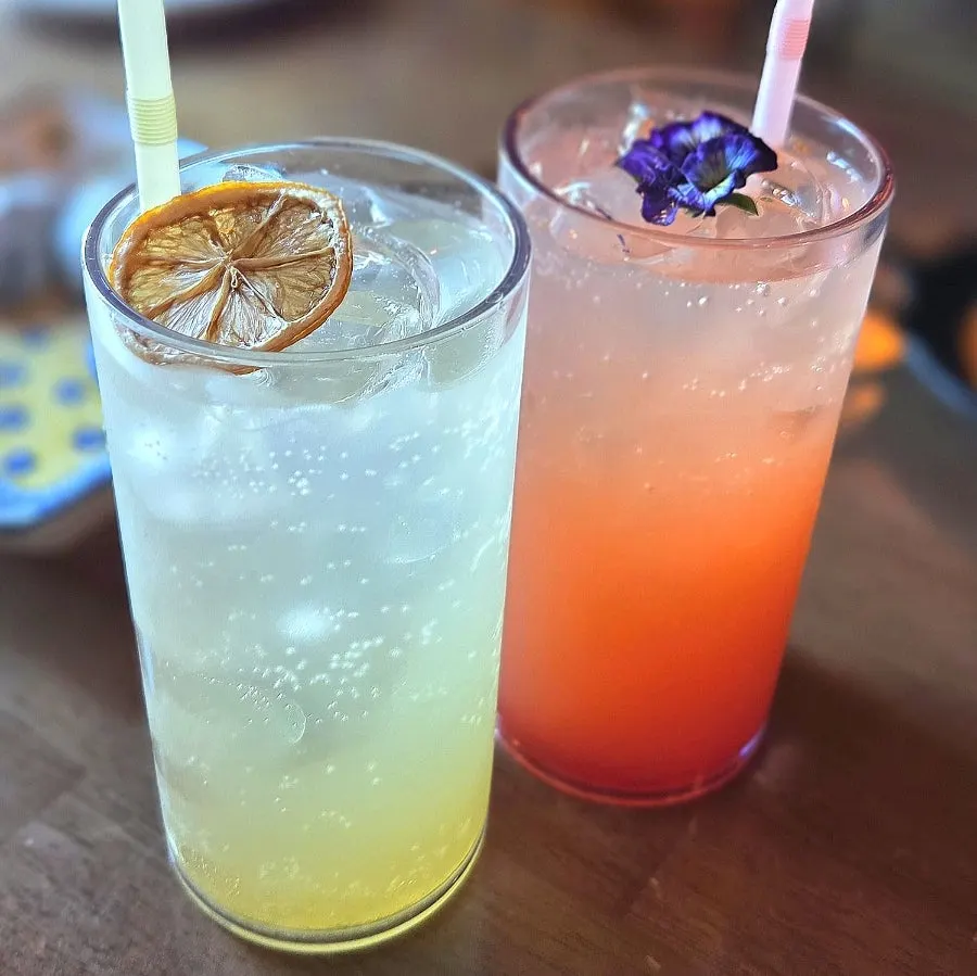 Two glasses of lemon citron ade and grapefruit ade