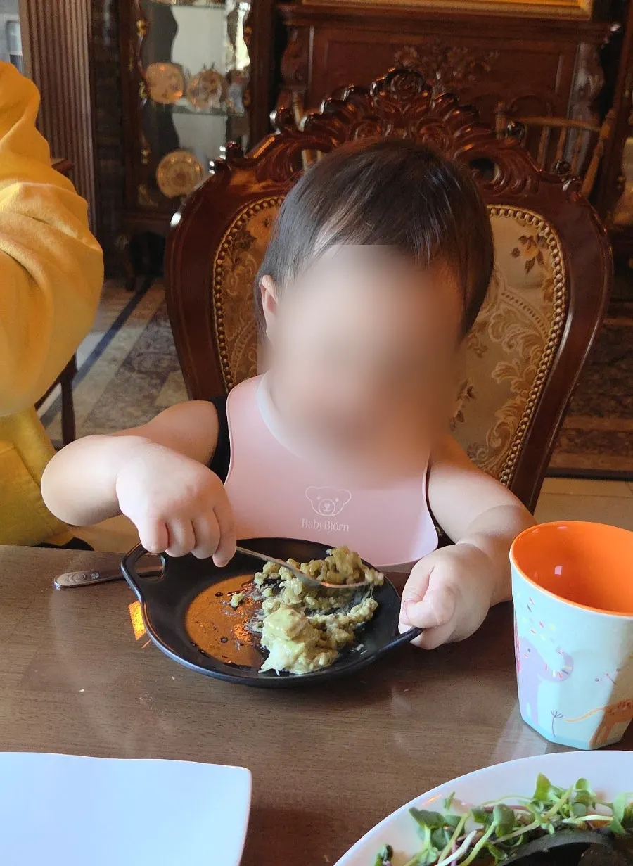 20-month-old baby eating the risotto