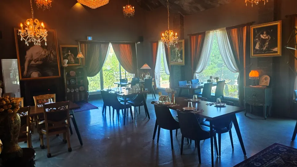 First floor interior of From Italy with a chandelier