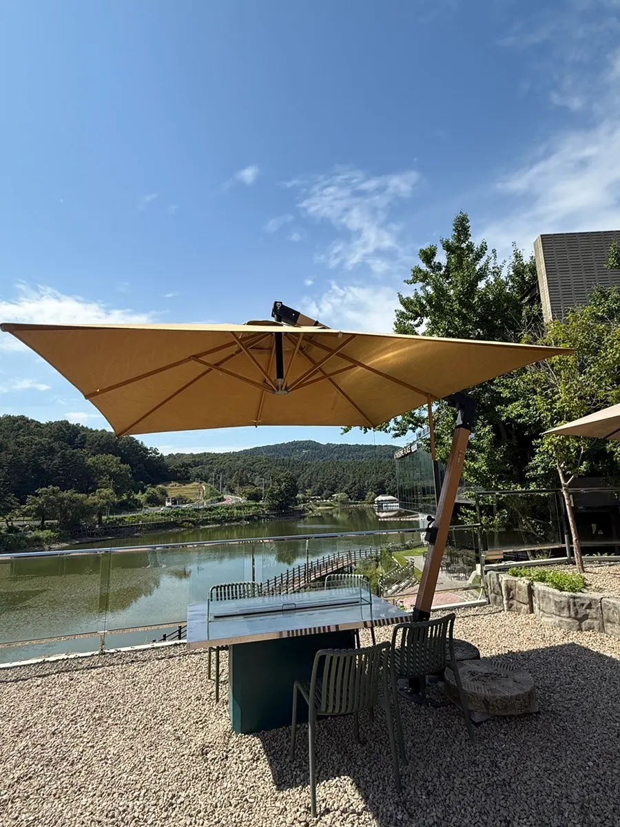 Outdoor tables with parasols