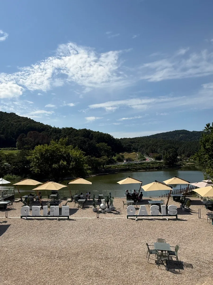 Outdoor area and reservoir viewed from rooftop seating