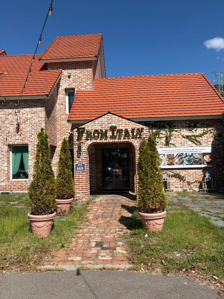 Exterior of From Italy Gomo-ri branch with red brick and orange roof