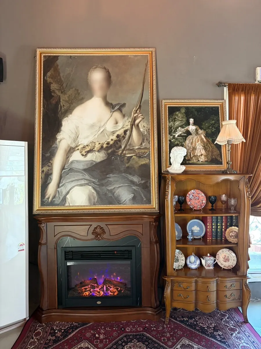 Gallery-like restaurant interior hung with paintings