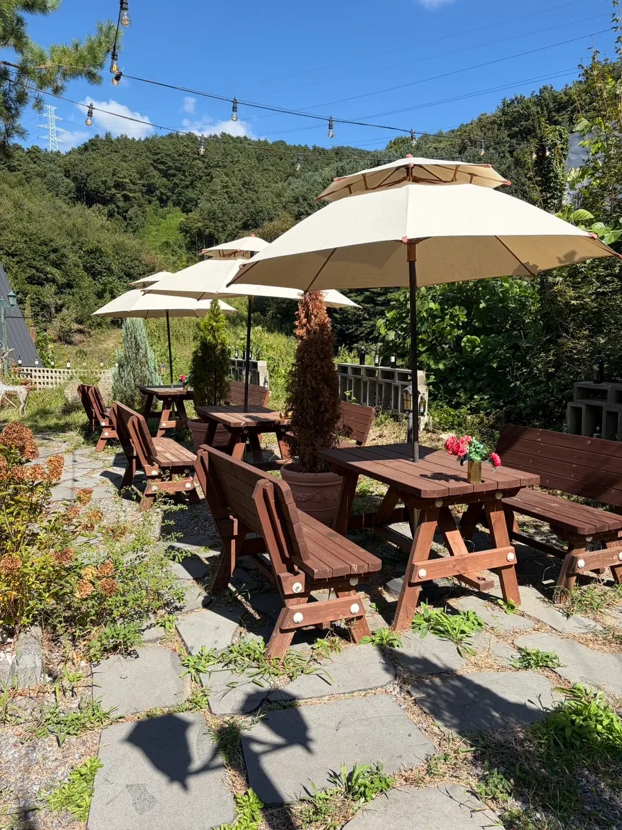 Outdoor space with parasol tables
