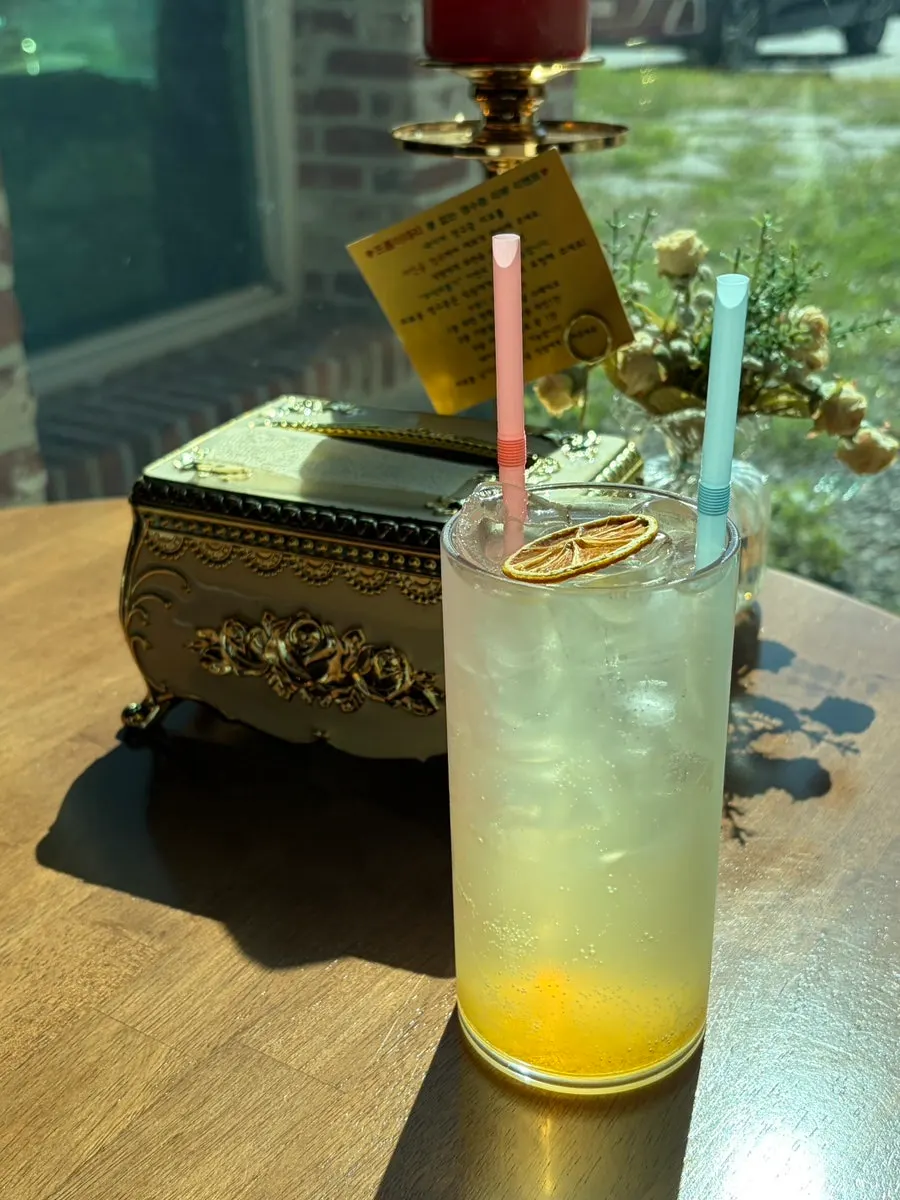 Lemon syrup ade, juice, and house-made pickles