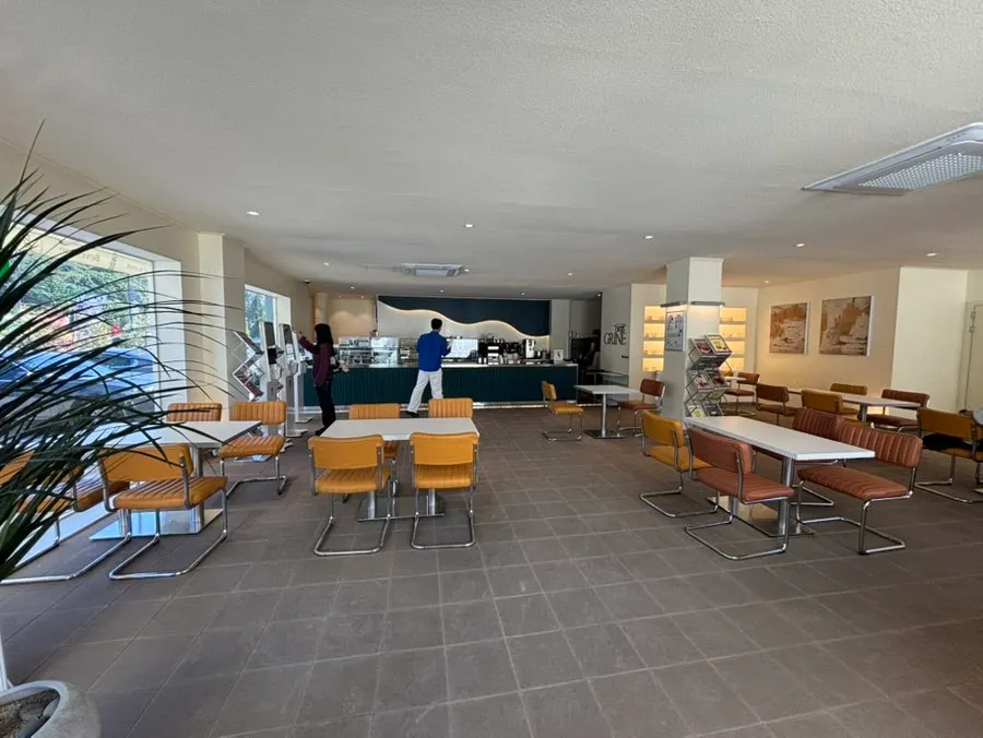 Interior of the main building with kiosks and counter