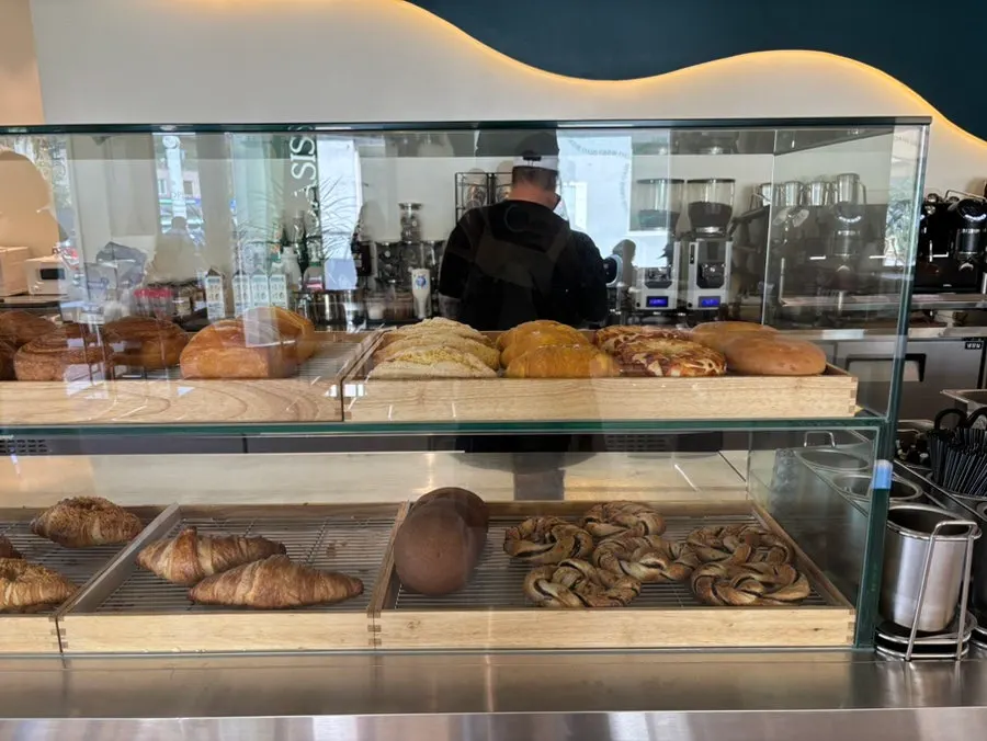 Display case with salt bread and croissants