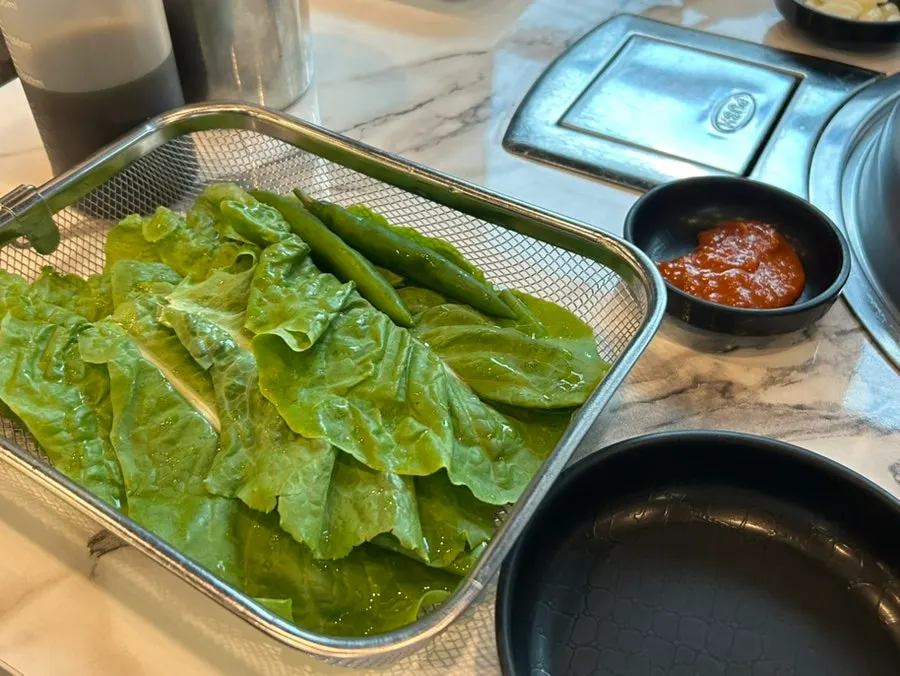 A full spread of side dishes with no table fee