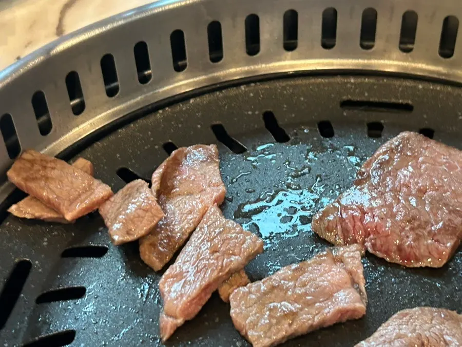 Hanwoo grilling over charcoal