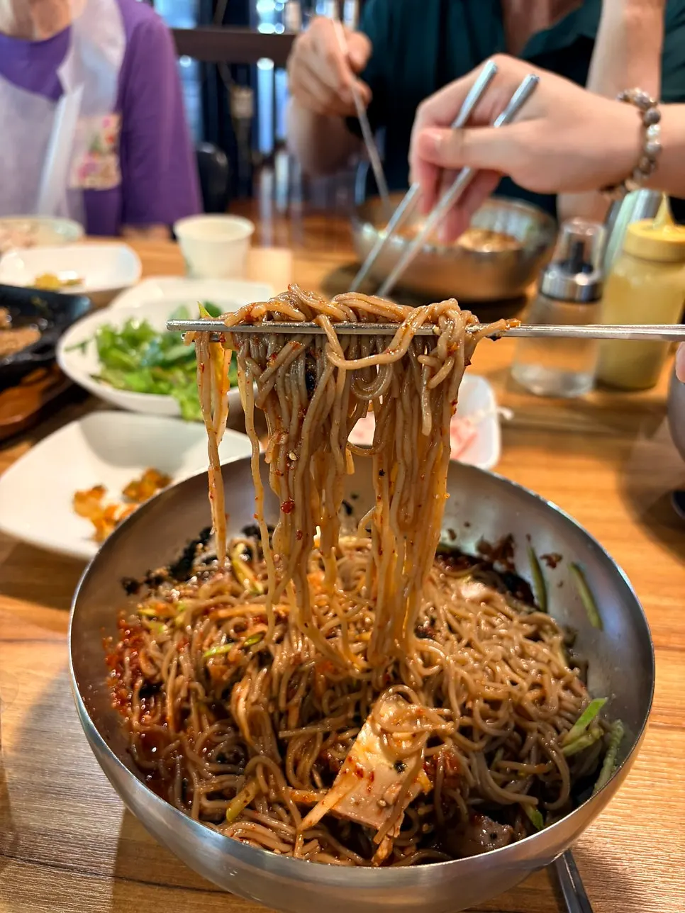 Bibim makguksu mixed evenly with sauce