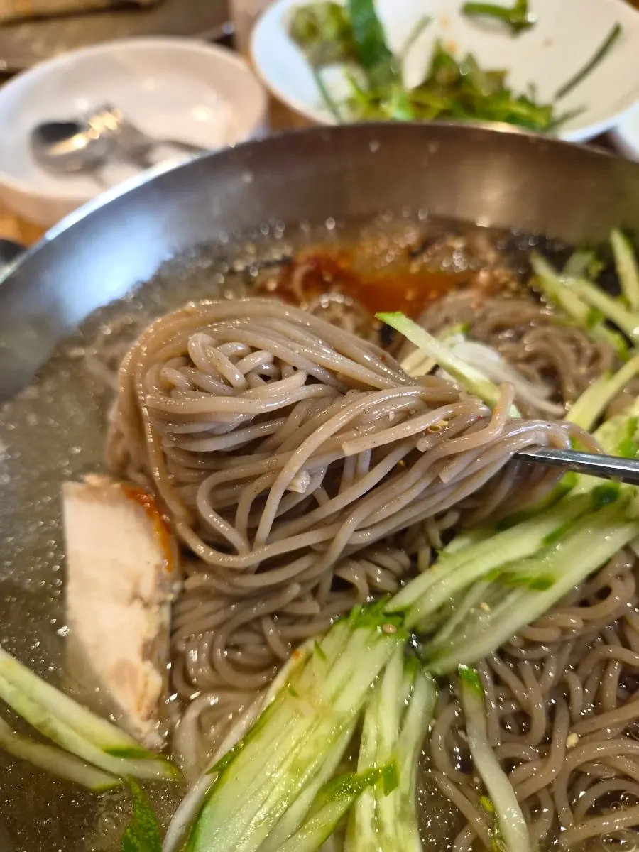 A large bowl of mulmakguksu at Myeongimong
