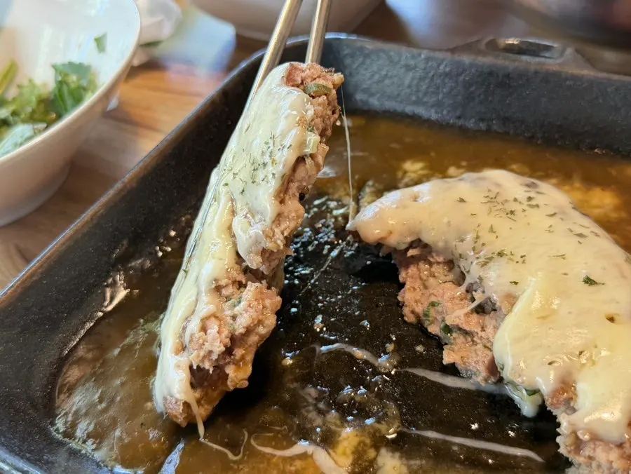 Melted cheese stretching from the cheese tteokgalbi