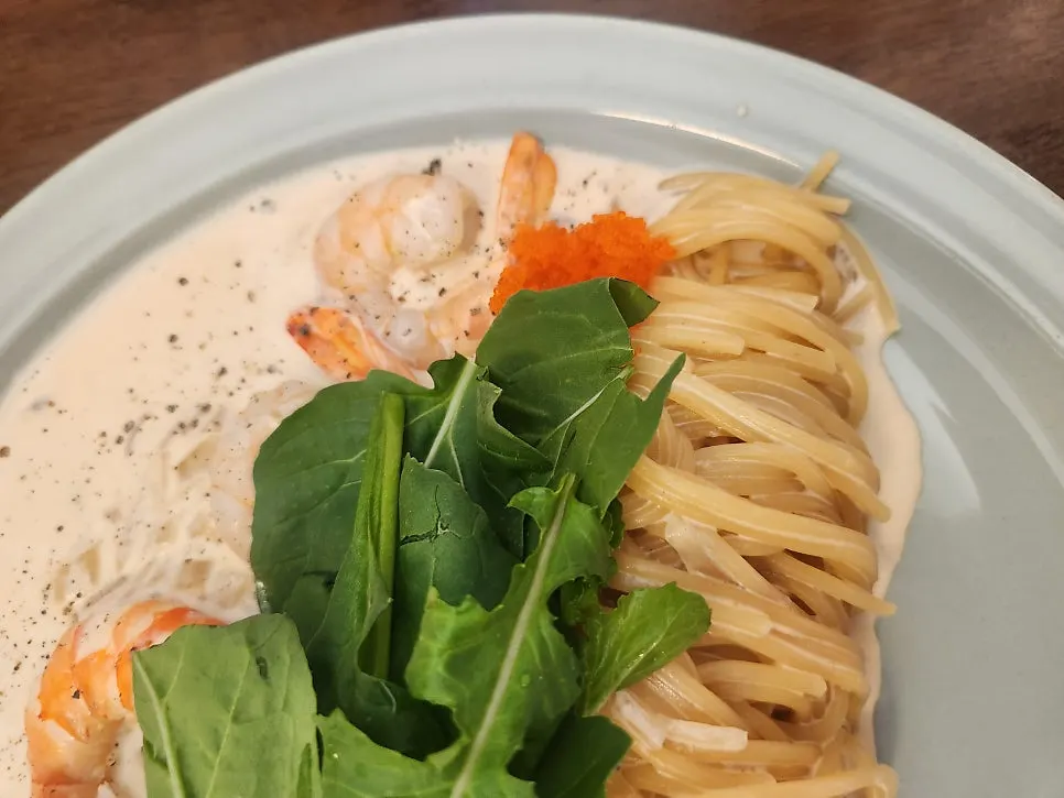 Chewy pasta noodles lifted with a fork
