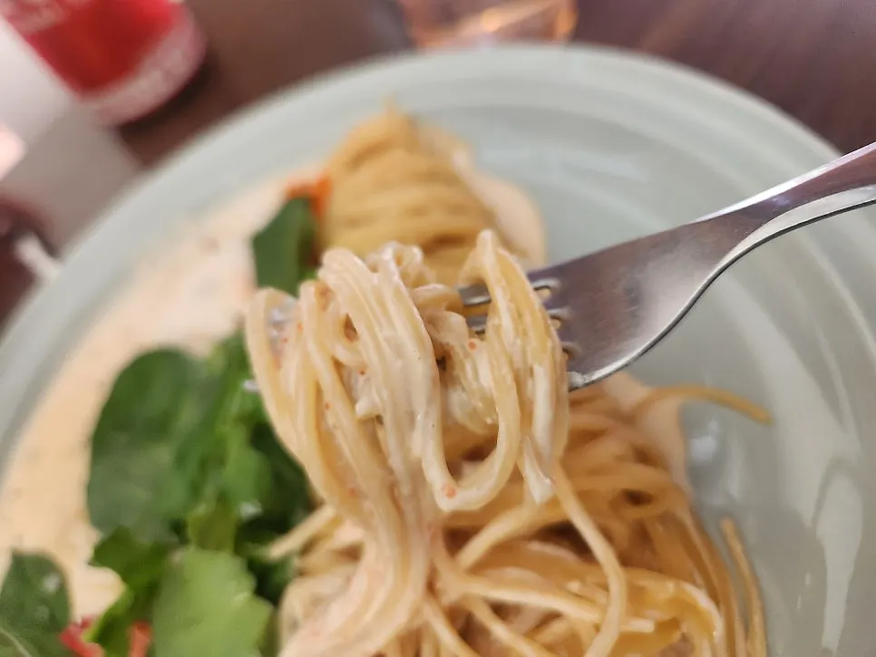 Red shrimp pasta coated in thick sauce