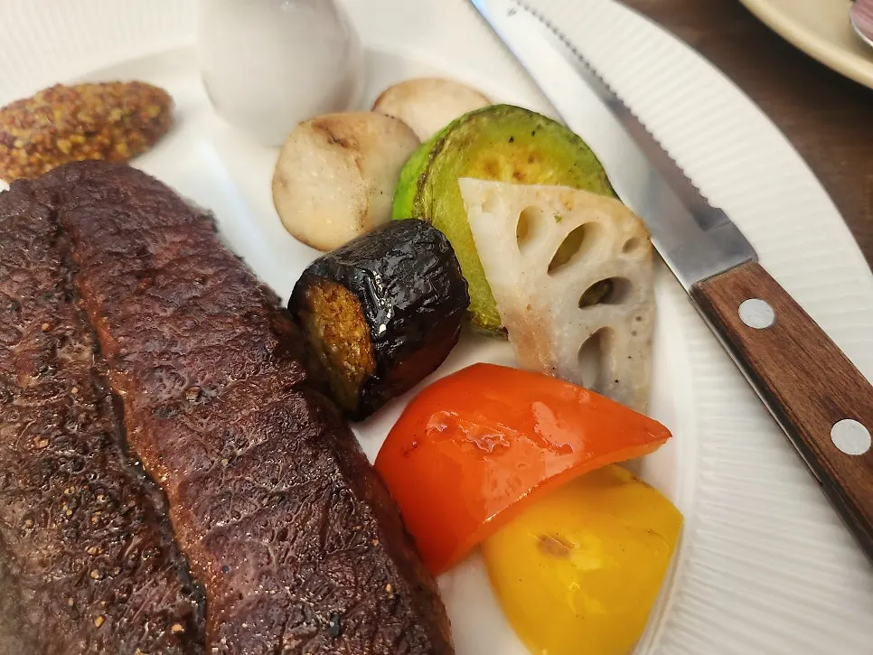 Steak plated together with side dishes